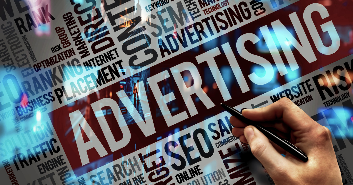 A dynamic word cloud focused on "ADVERTISING" and marketing terminology such as SEO, Traffic, and Placement. A hand is shown pointing a pen toward the digital interface, symbolizing the intentional design and manipulation of the modern media landscape.